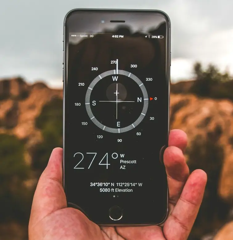 selective focus photography of person holding space gray iPhone 6